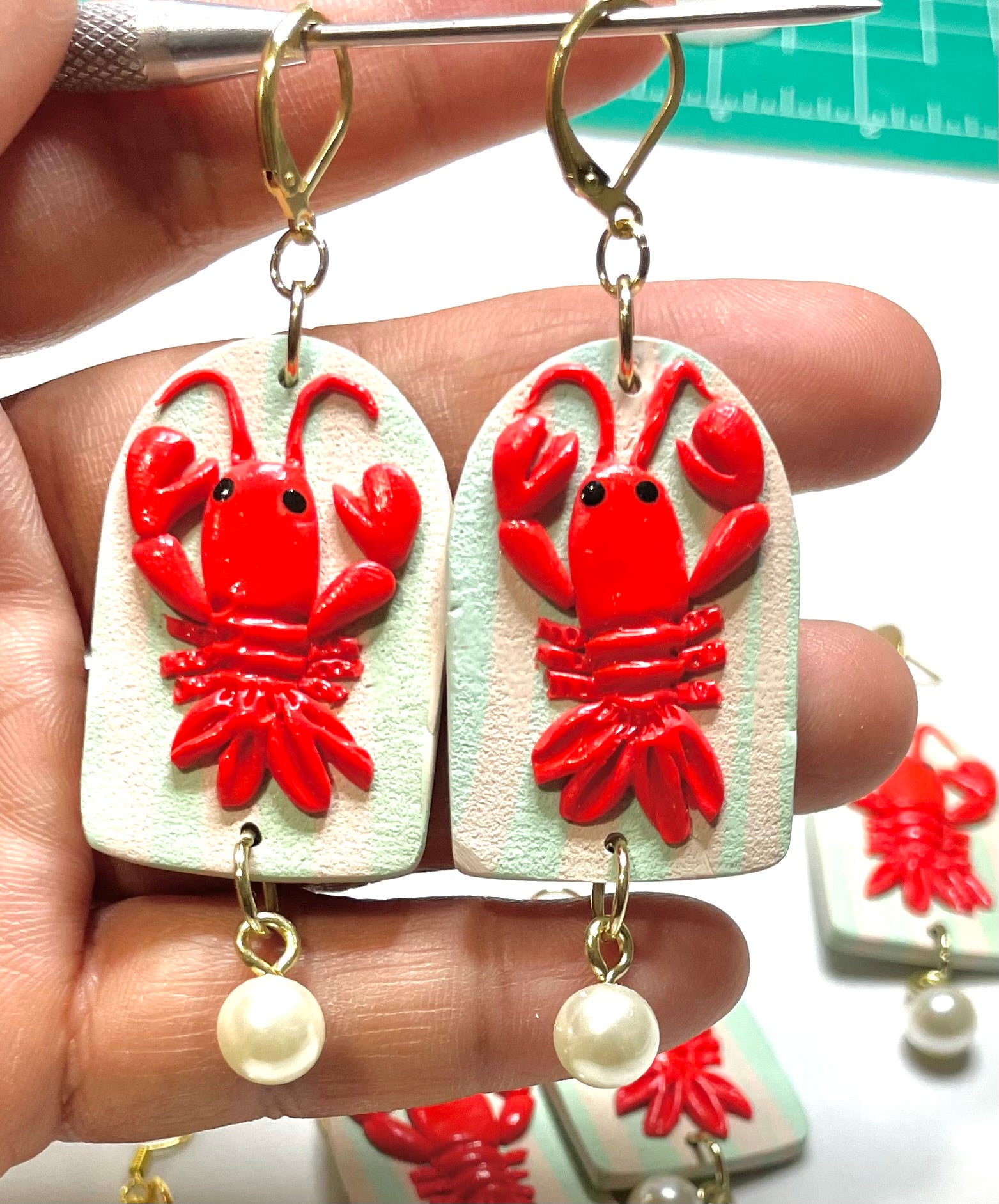 Red lobster and pearl earrings