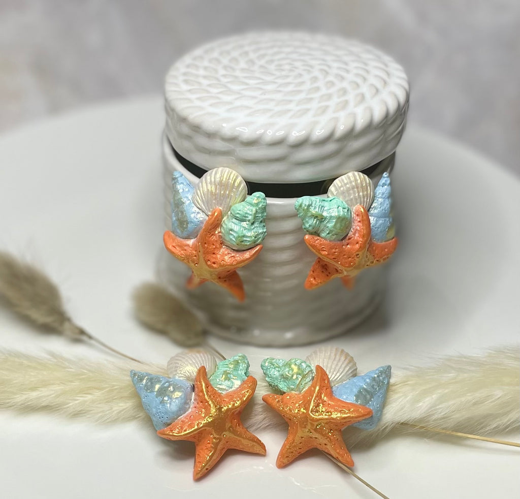 Orange star fish and seashells with gold accents