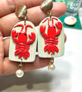 Lobster and pearl earrings