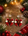 Red and white bow with poinsettia in center