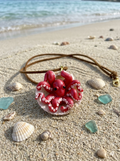 Red octopus in scallop shell necklace